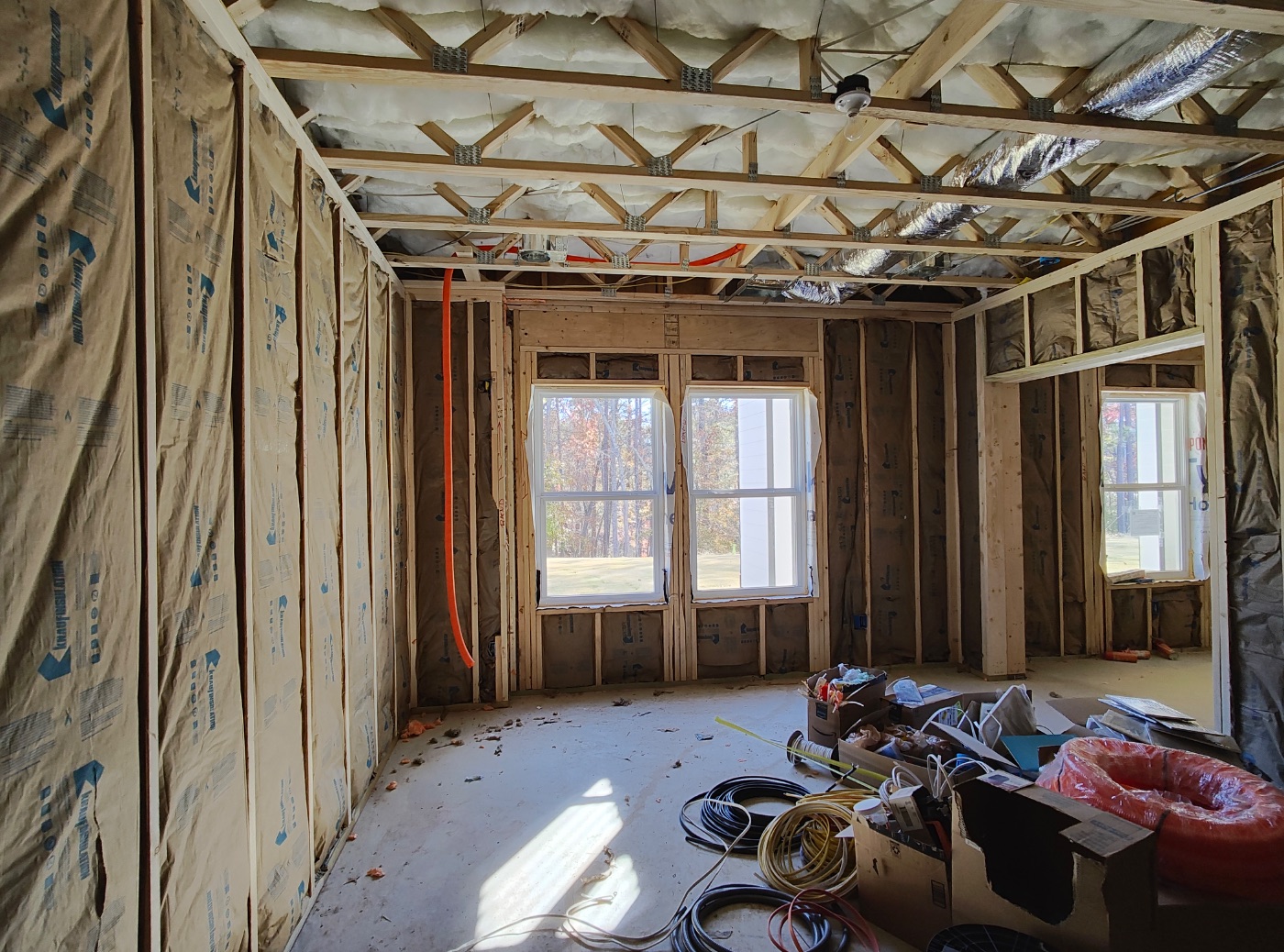 Insulation worked around ducts and PEX, never compressed