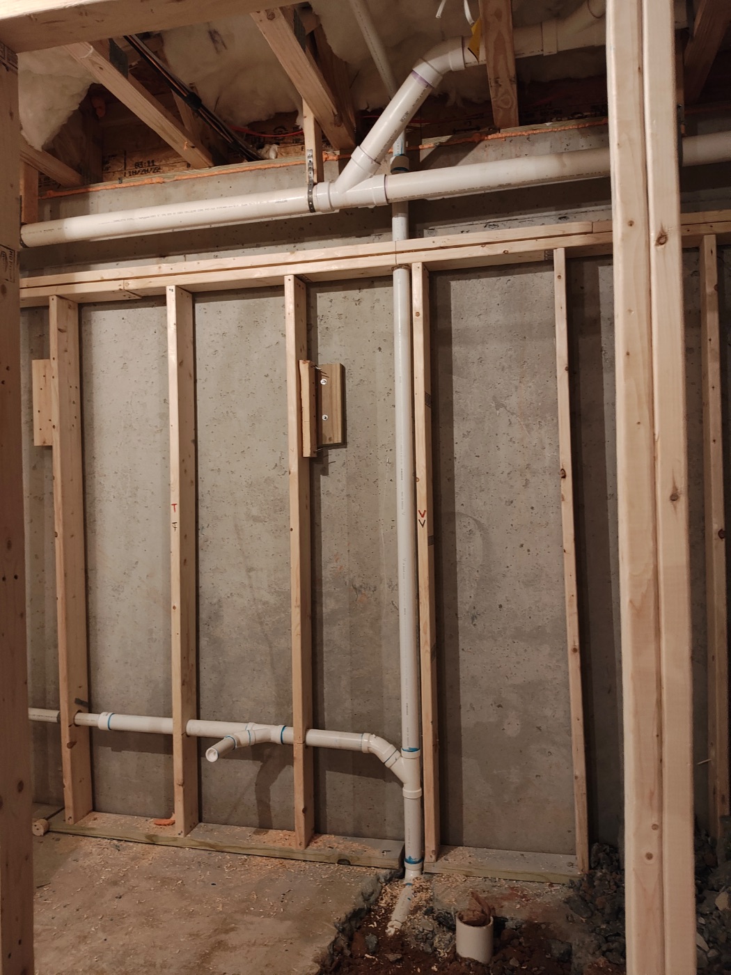 Vent riser up the wall to the main overhead