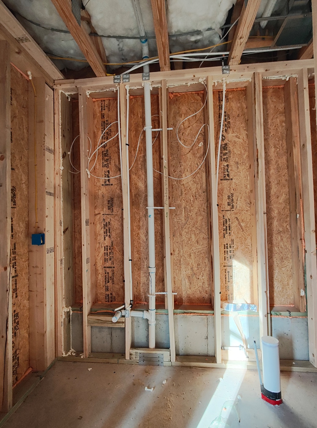 Vent stack run plumb and strapped, rim joist sealed