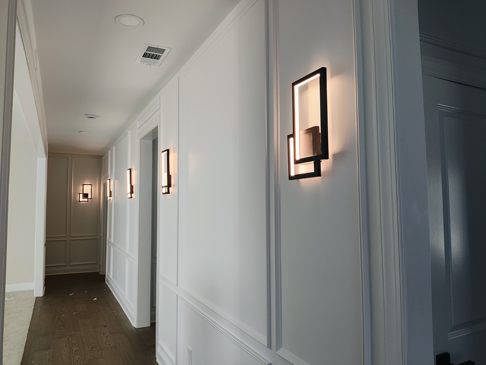 Applied frame moulding in a hallway